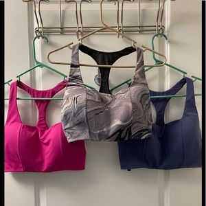 Victoria’s Secret pink, blue, and marble sports bras 34DD
